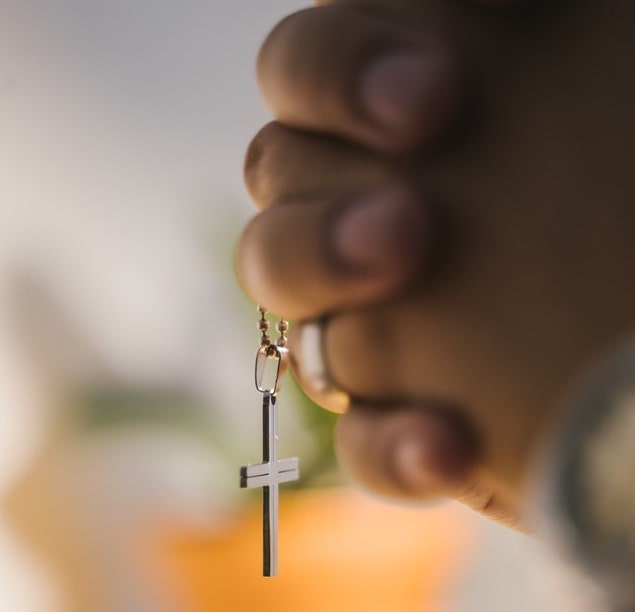 man holding a cross