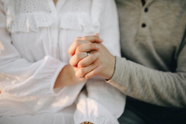 couple holds hands